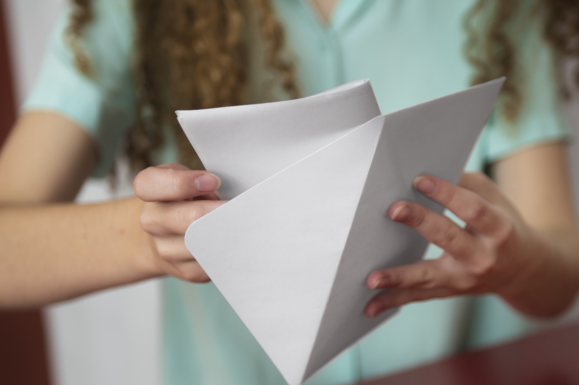 front-view-woman-holding-envelope.jpg